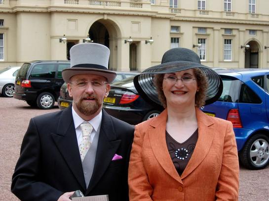 Christine Burns MBE and Stephen Whittle OBE at Buckingham Palace